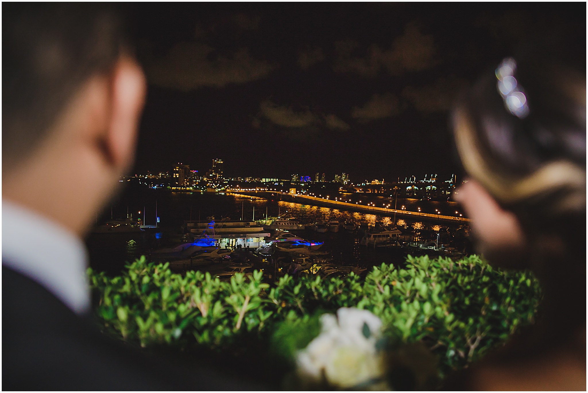 married couple overlooking downtown miami cityscape