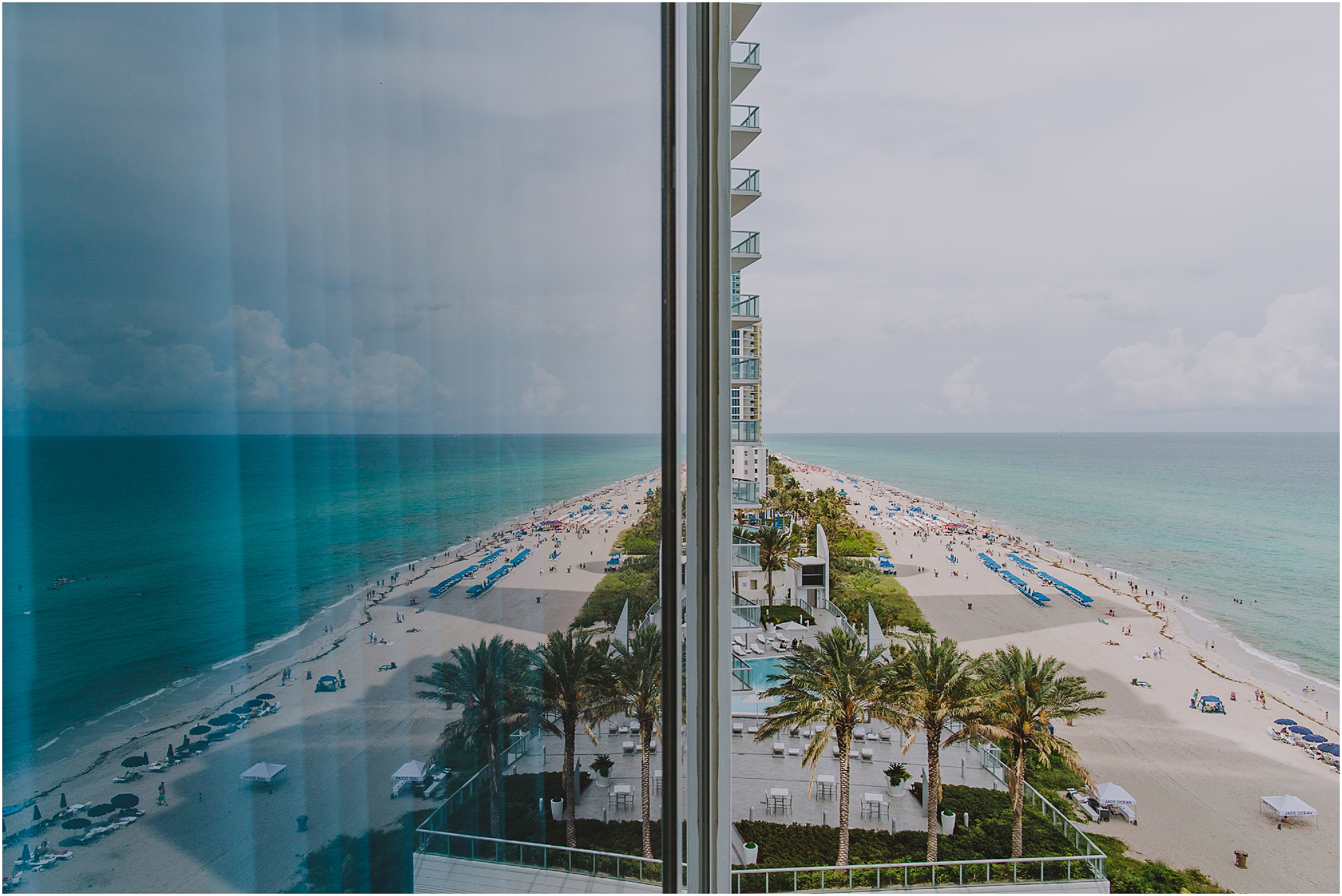 a flection of miami beach on a window