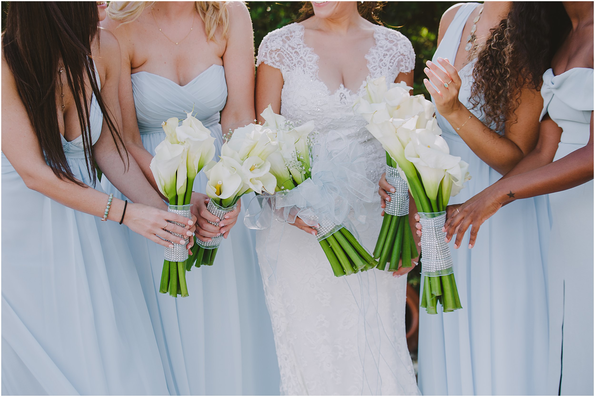 bridesmaids holding calla lily bouquets 