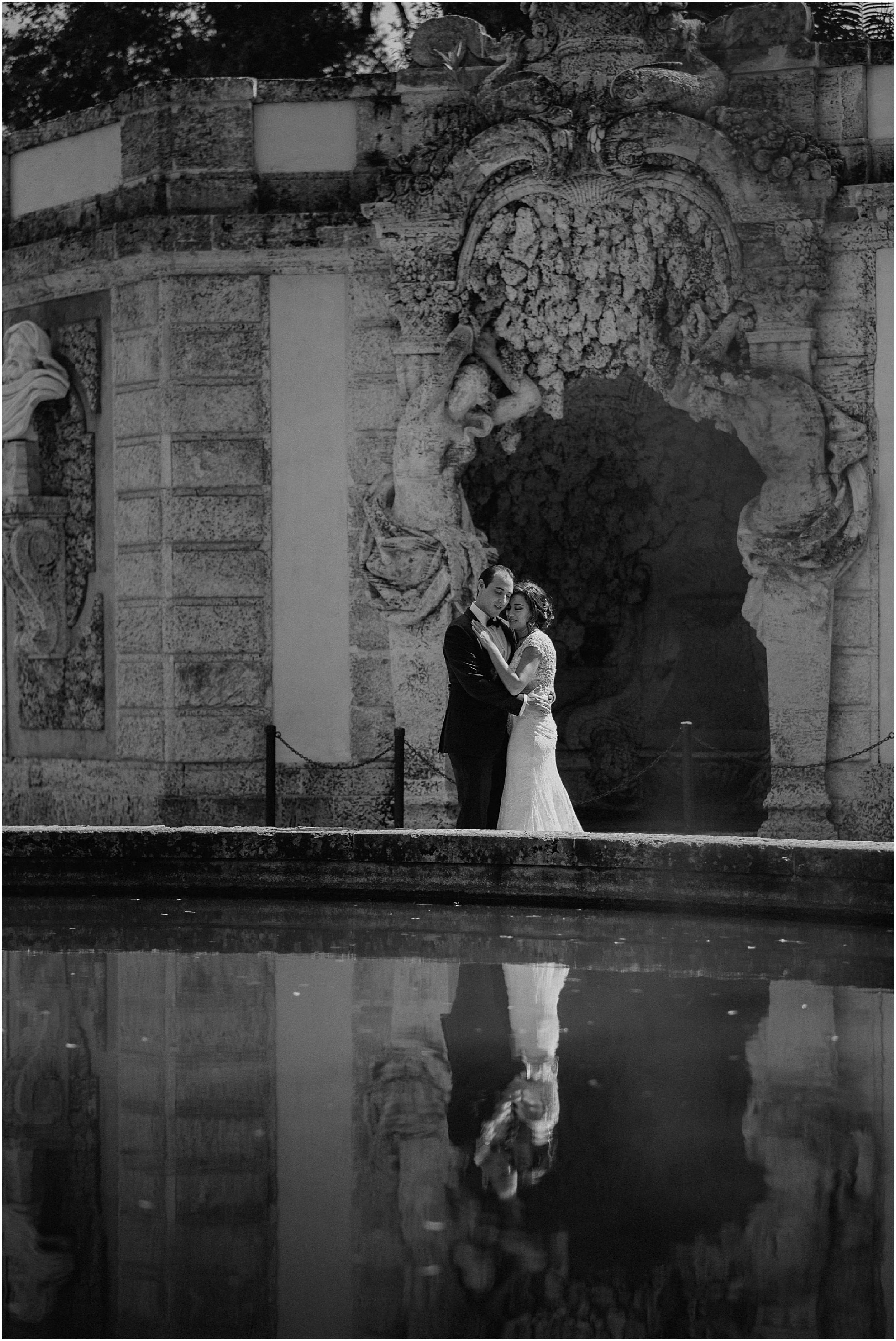 bride and groom in front of the fountain at Vizcaya Museum & Gardens