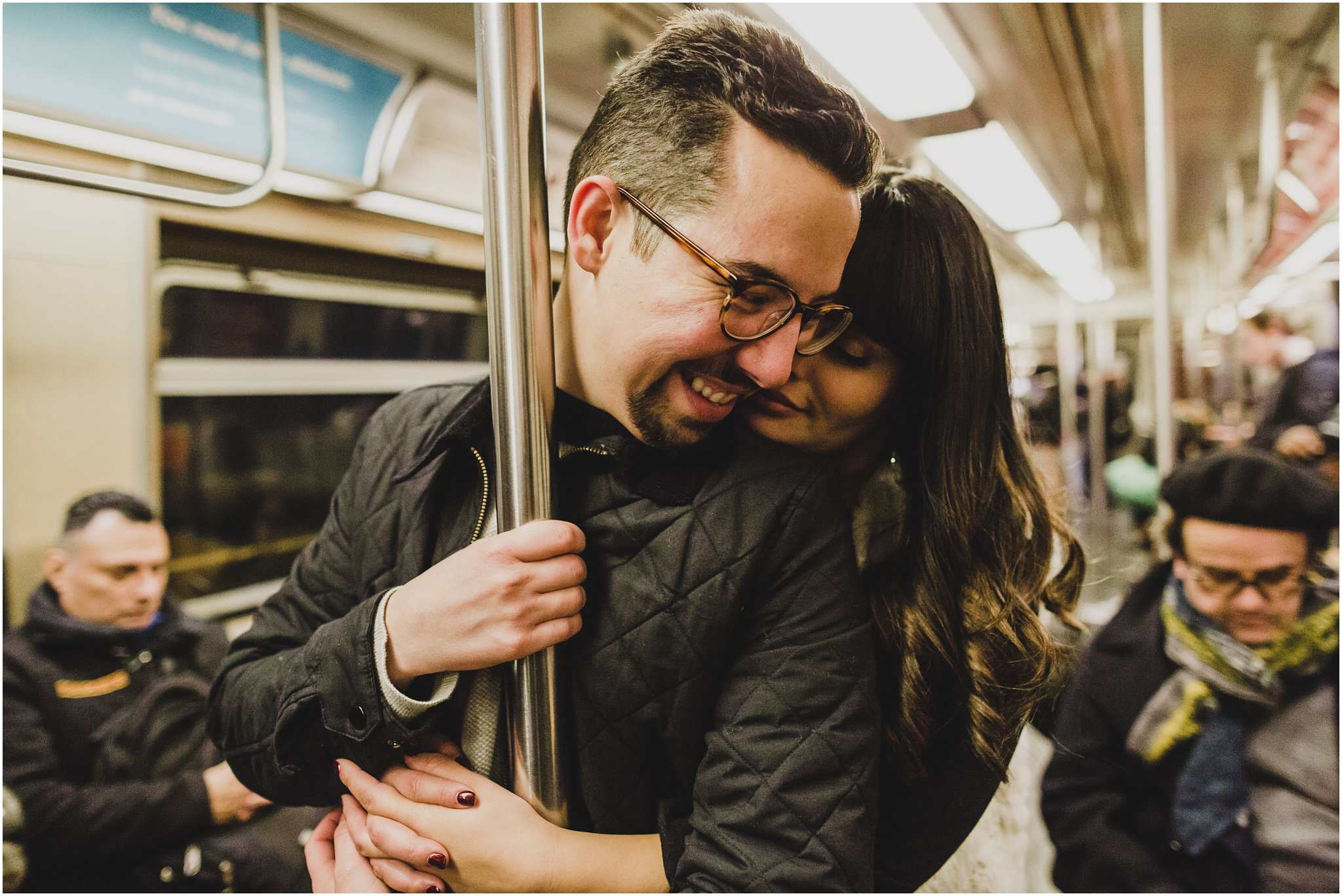 couple laughing in the subway