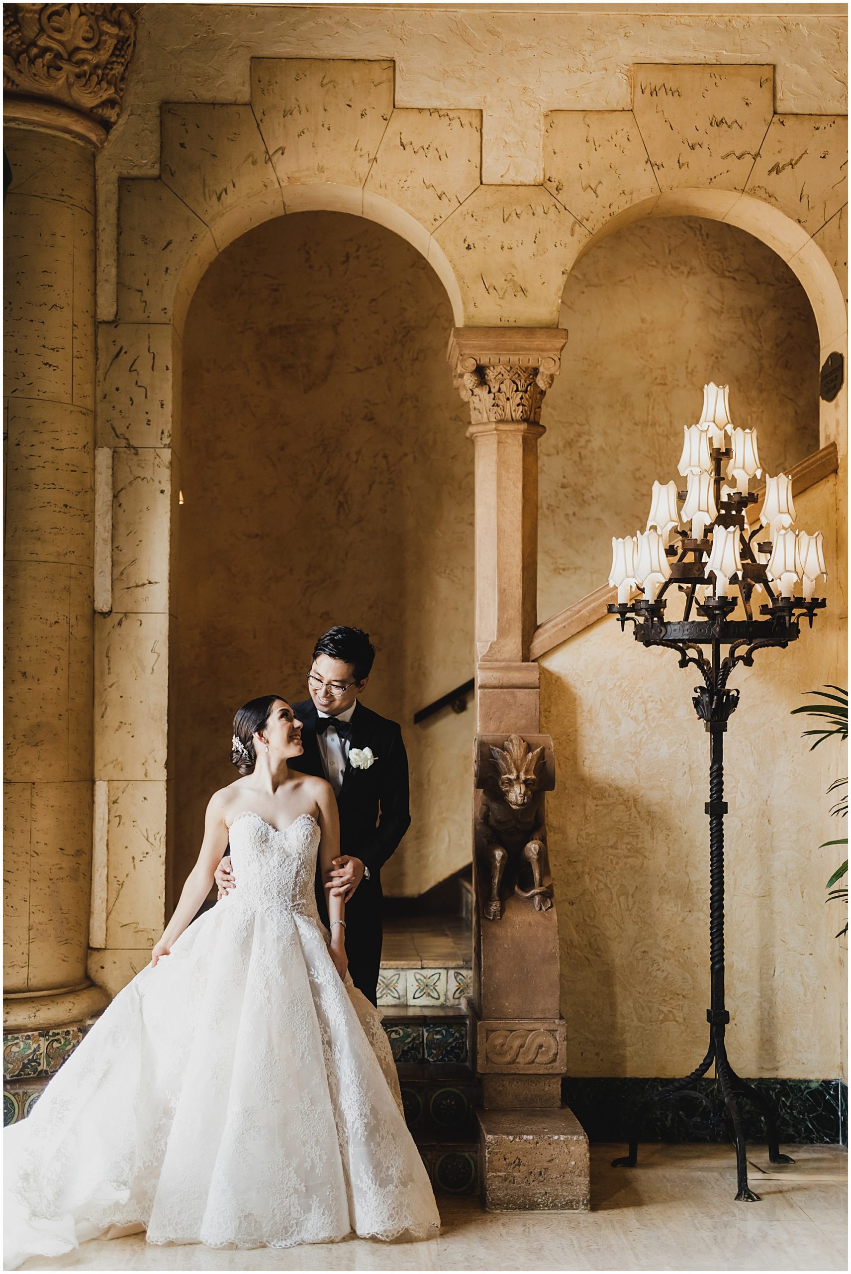 Portrait of the bride and groom in the lobby of the Biltmore Hotel in Coral gables.