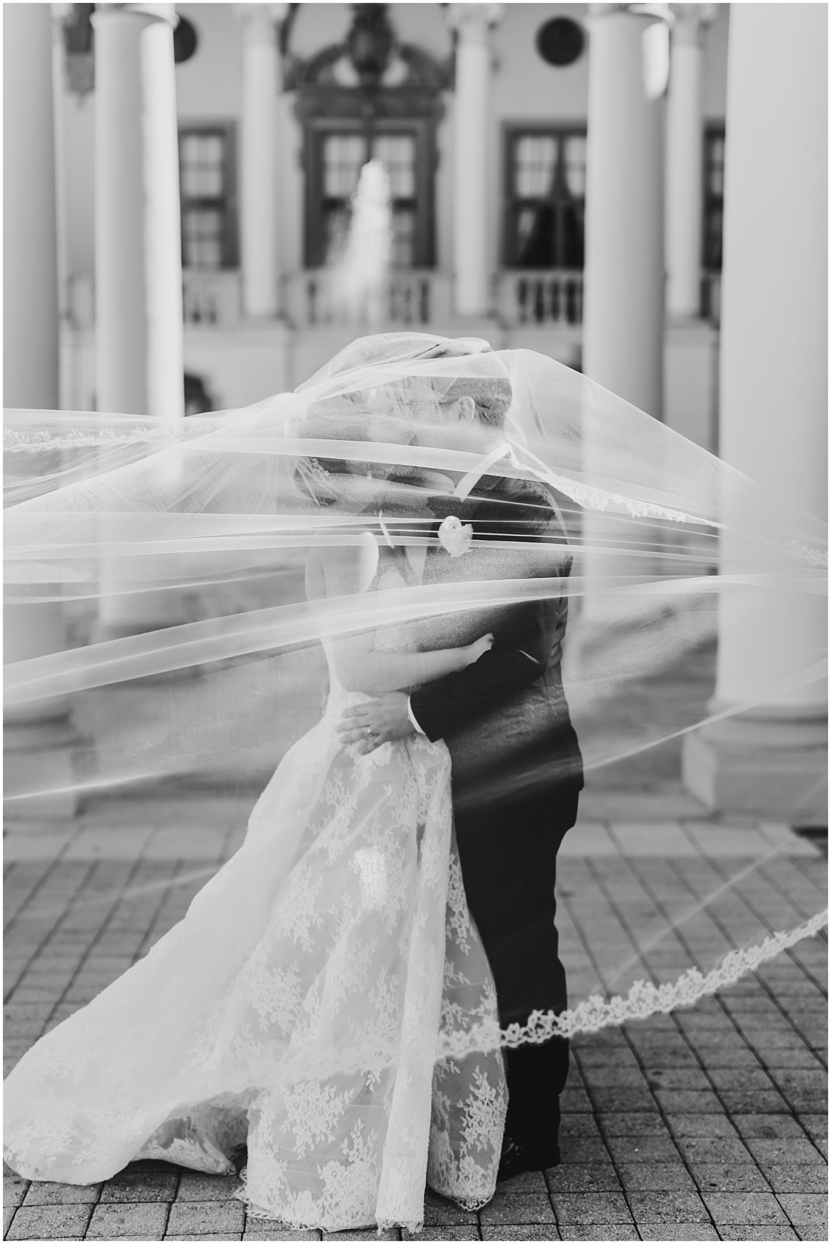 Creative vail shot of the bride and groom at the Biltmore Hotel in coral gables.